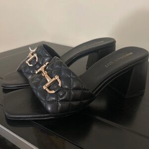 75) Madden girl black and gold pumps